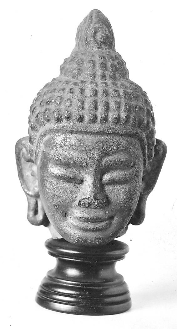 Head of a Buddha, Stone with paint and gilt, Cambodia 
