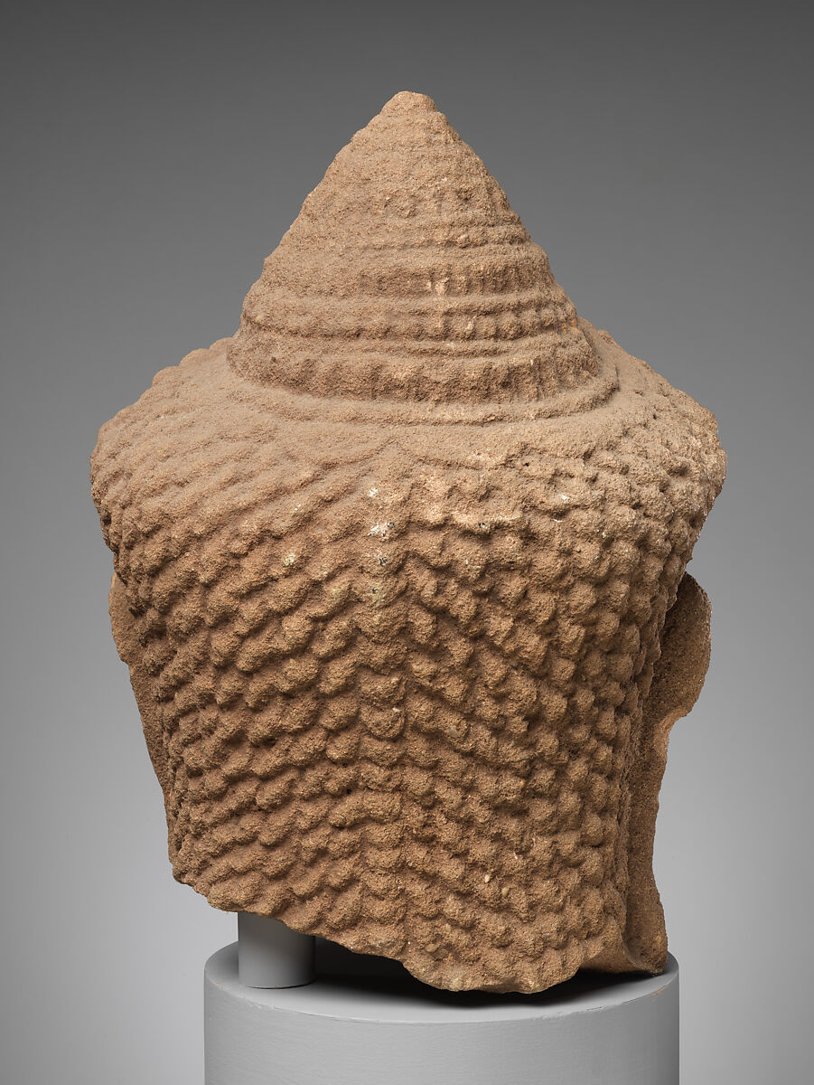 Head of a Deity(?), Red sandstone, Cambodia