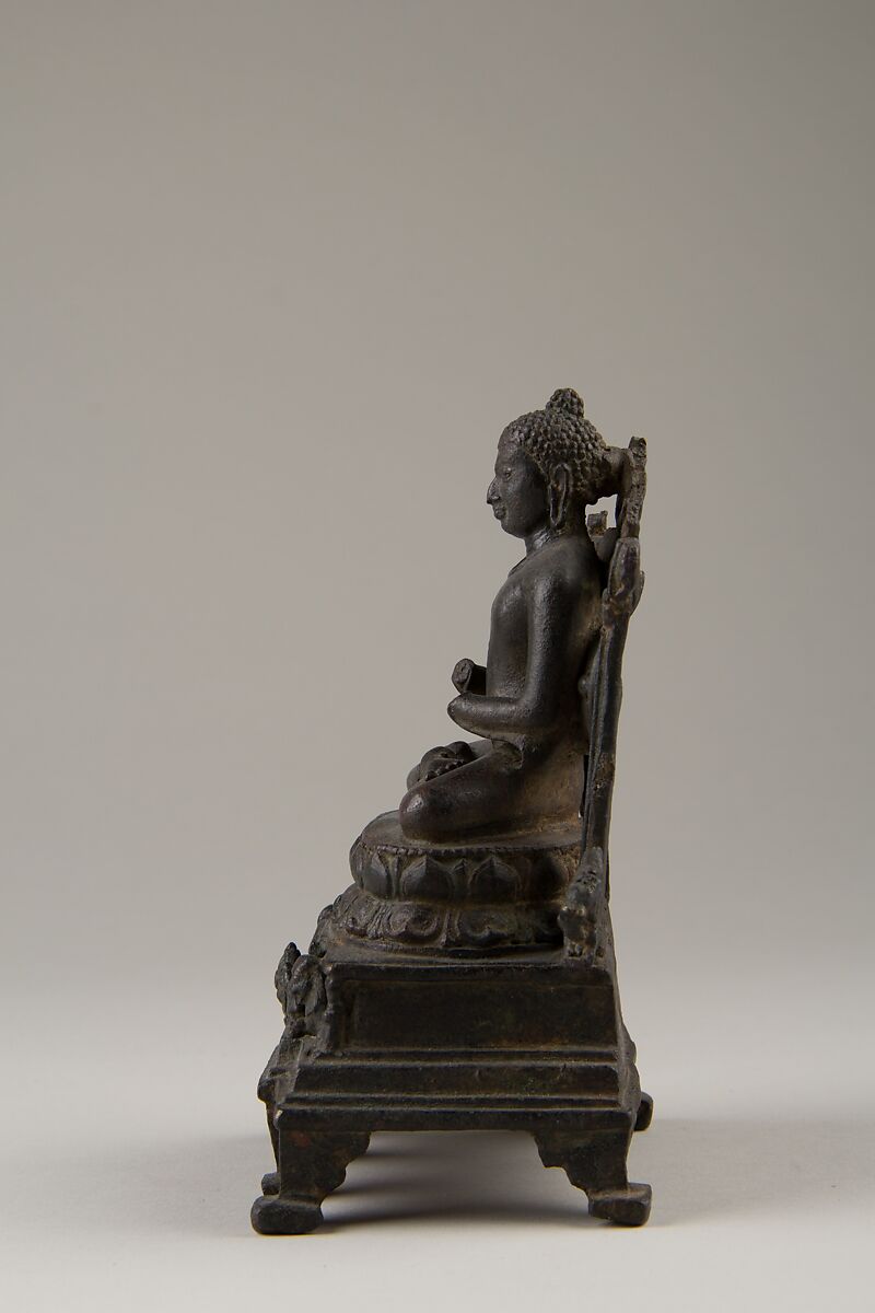 Enthroned Preaching Buddha, Bronze with silver inlay, India (Bihar)