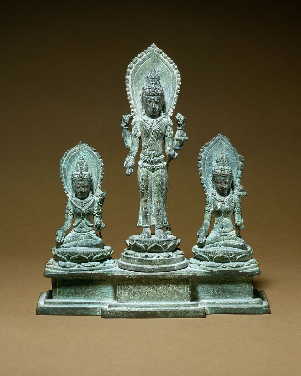 Standing Four-Armed Avalokiteshvara Flanked by Tara and Bhrikuti(?), Bronze with silver inlay, Indonesia (Java) 