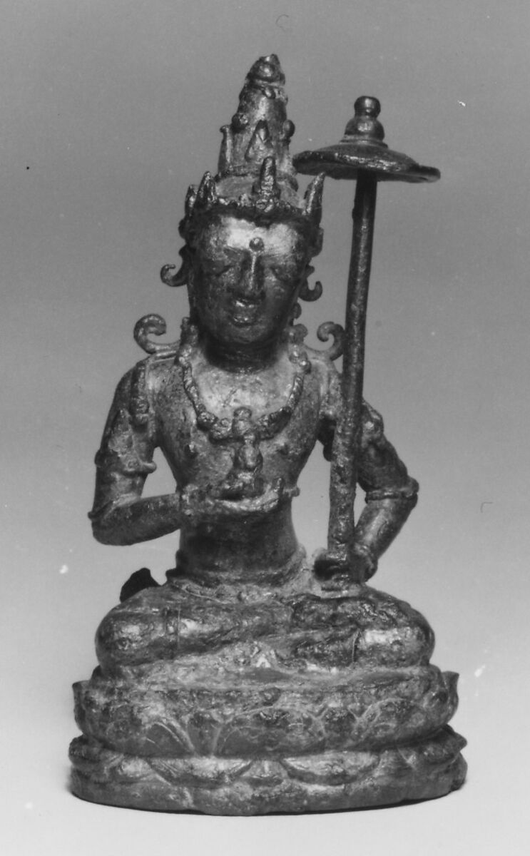 Seated Male Deity Holding a Parasol and an Unidentified Object, Bronze, Indonesia (Java, Ngandjuk) 