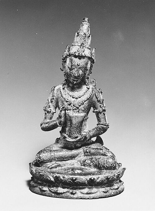 Seated Male Deity Holding a Cuirass (Chest Armour), Bronze, Indonesia (Java, Ngandjuk) 