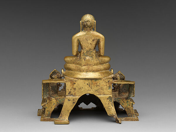 Svetambara Enthroned Jina, with Attendant Yaksha and Yakshi, Copper alloy inlaid with silver and copper, India (Gujarat)