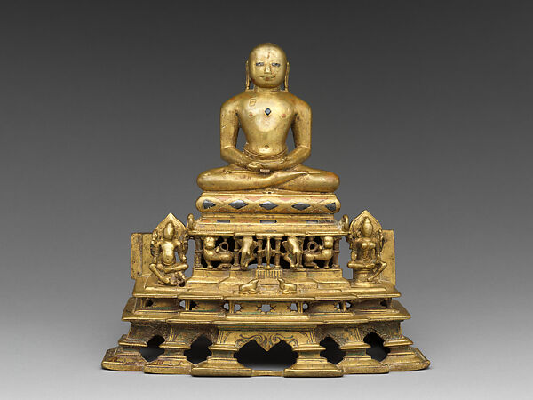 Svetambara Enthroned Jina, with Attendant Yaksha and Yakshi, Copper alloy inlaid with silver and copper, India (Gujarat) 