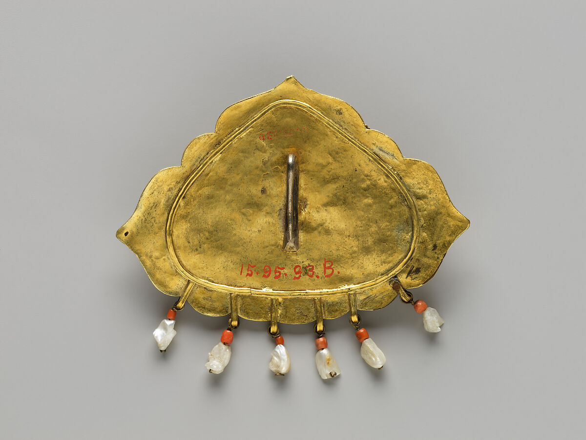 Woman’s Brooch with Monster Mask, Gilt silver, rubies, sapphires, emeralds, coral, pearls, mother-of-pearl, and turquoise, Nepal