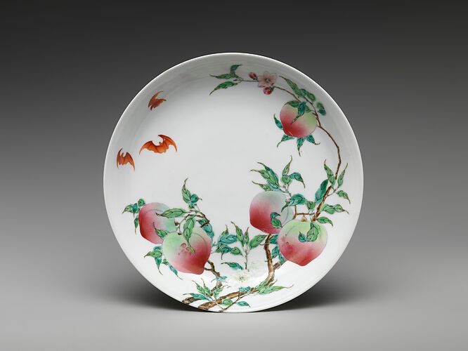 Dish with peaches and bats