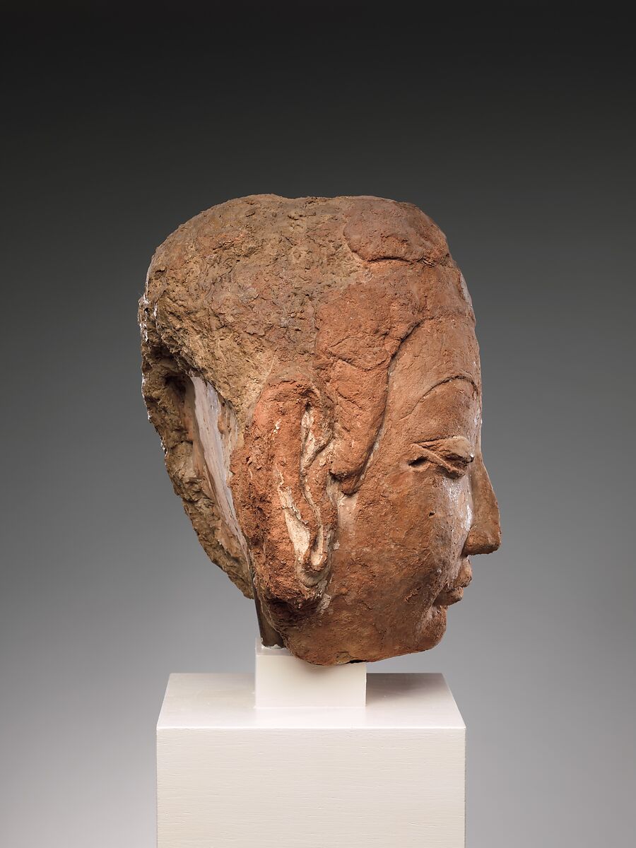 Head of Buddha, Red clay with traces of color, China (Xinjiang Autonomous Region)