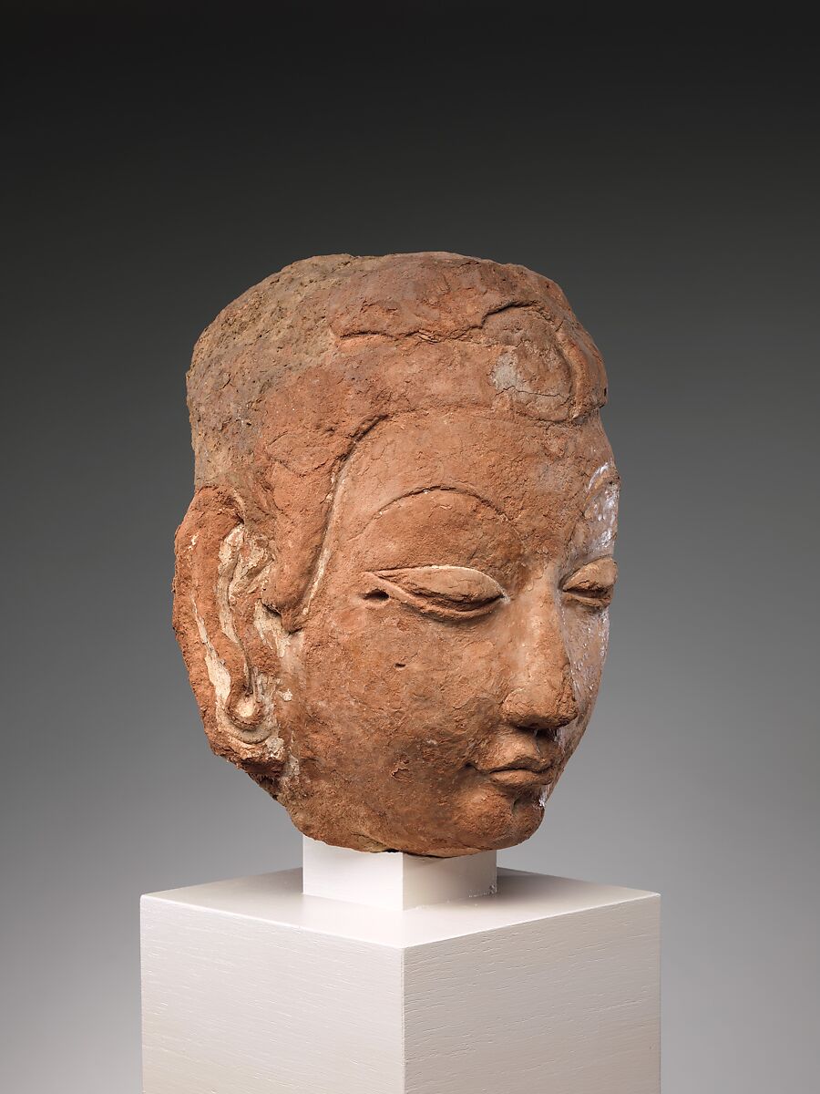 Head of Buddha, Red clay with traces of color, China (Xinjiang Autonomous Region)