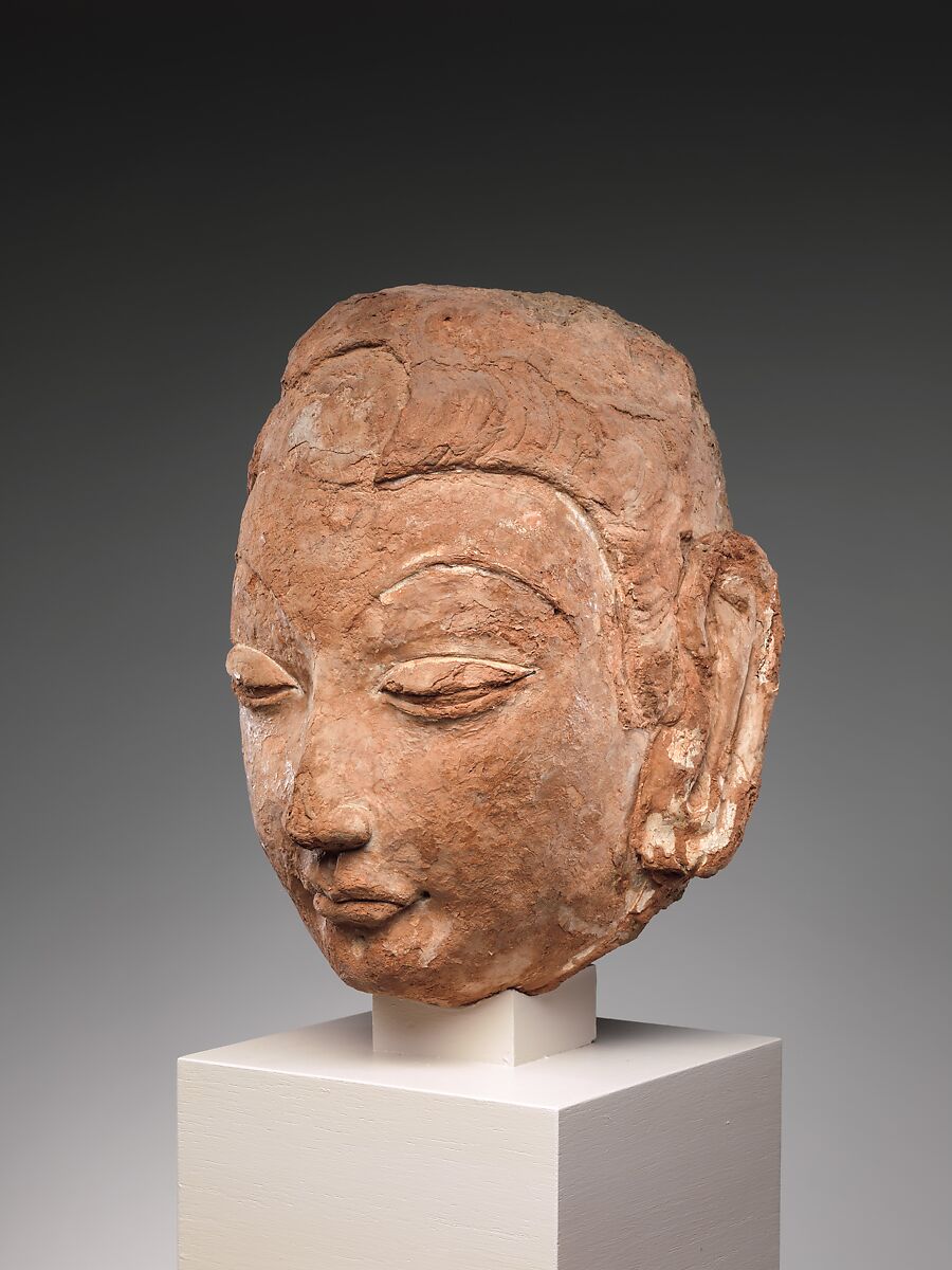 Head of Buddha, Red clay with traces of color, China (Xinjiang Autonomous Region)