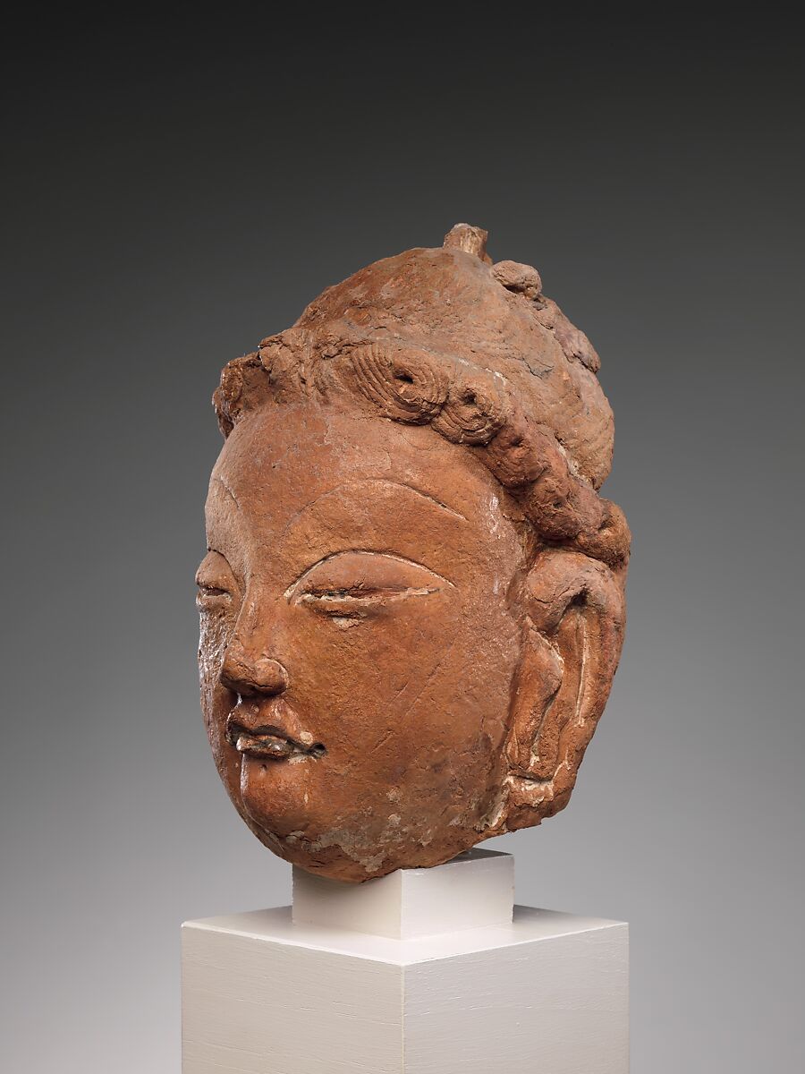 Head of a Bodhisattva, Red clay with traces of color, China (Xinjiang Autonomous Region)
