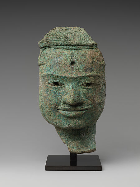 Face from a Male Deity, probably Shiva, Bronze with silver inlay, Cambodia 