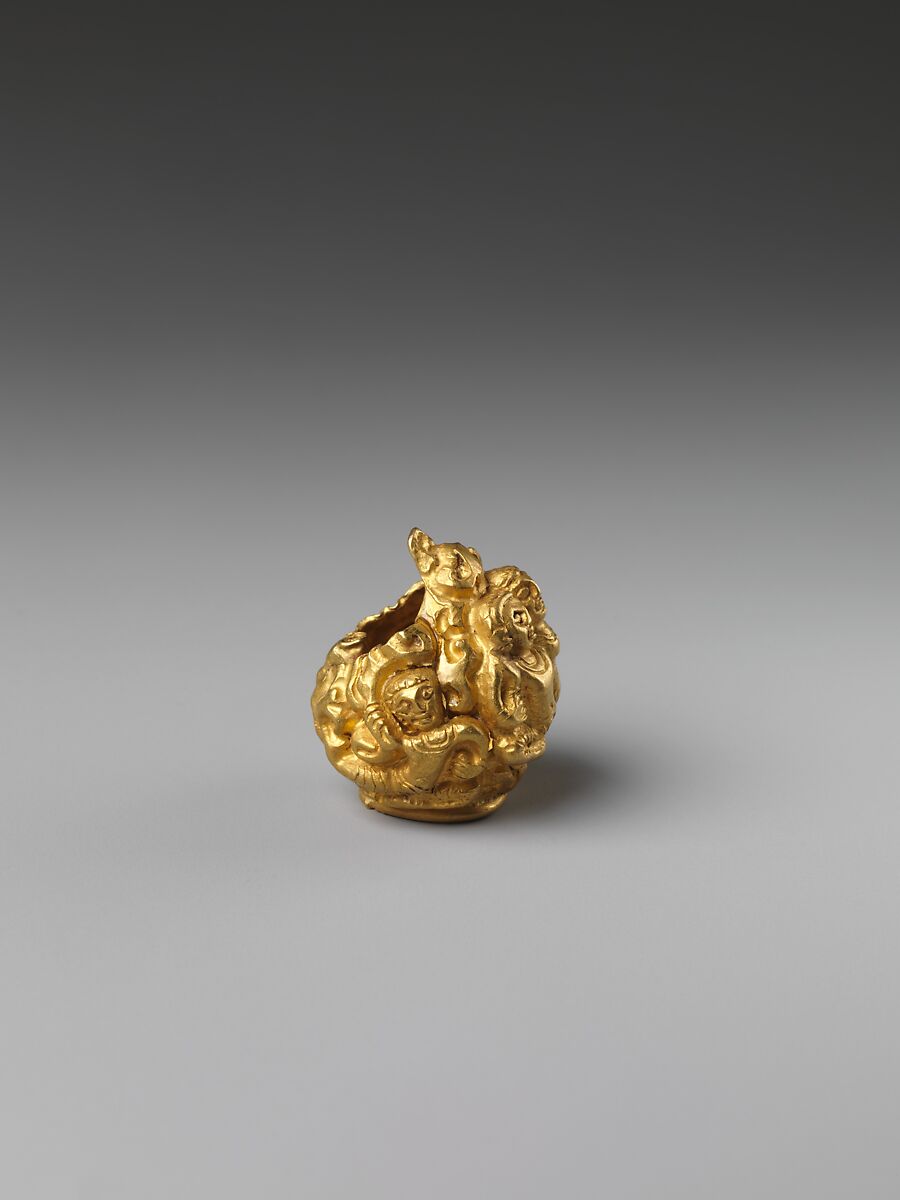 Rod Finial Clip with Deity Surrounded by Sekti Motif, Gold, Indonesia (Java)