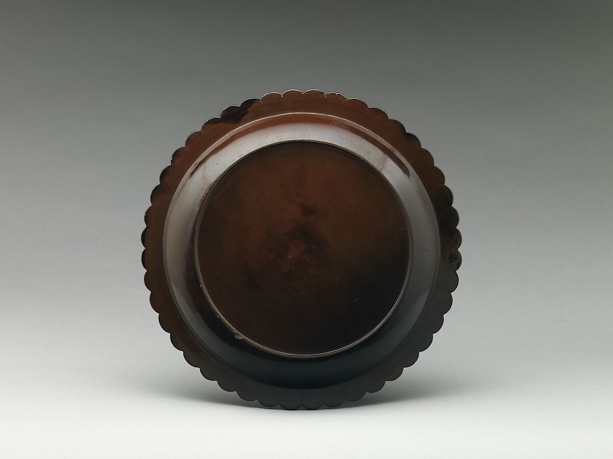 Dish with chrysanthemum-petal rim, Black lacquer with traces of gold decoration, China