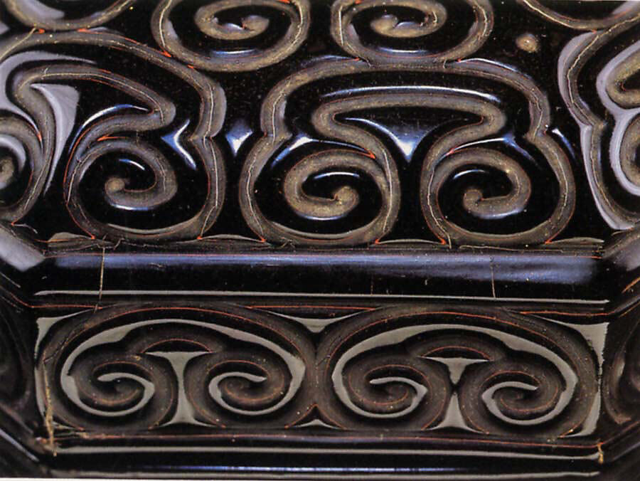 Octagonal box with pommel scrolls, Carved black lacquer with red layers (tixi), China