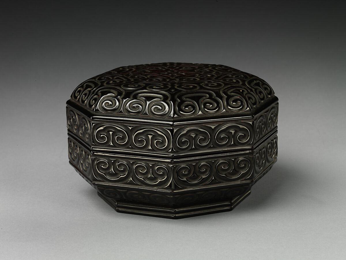 Octagonal box with pommel scrolls, Carved black lacquer with red layers (tixi), China 