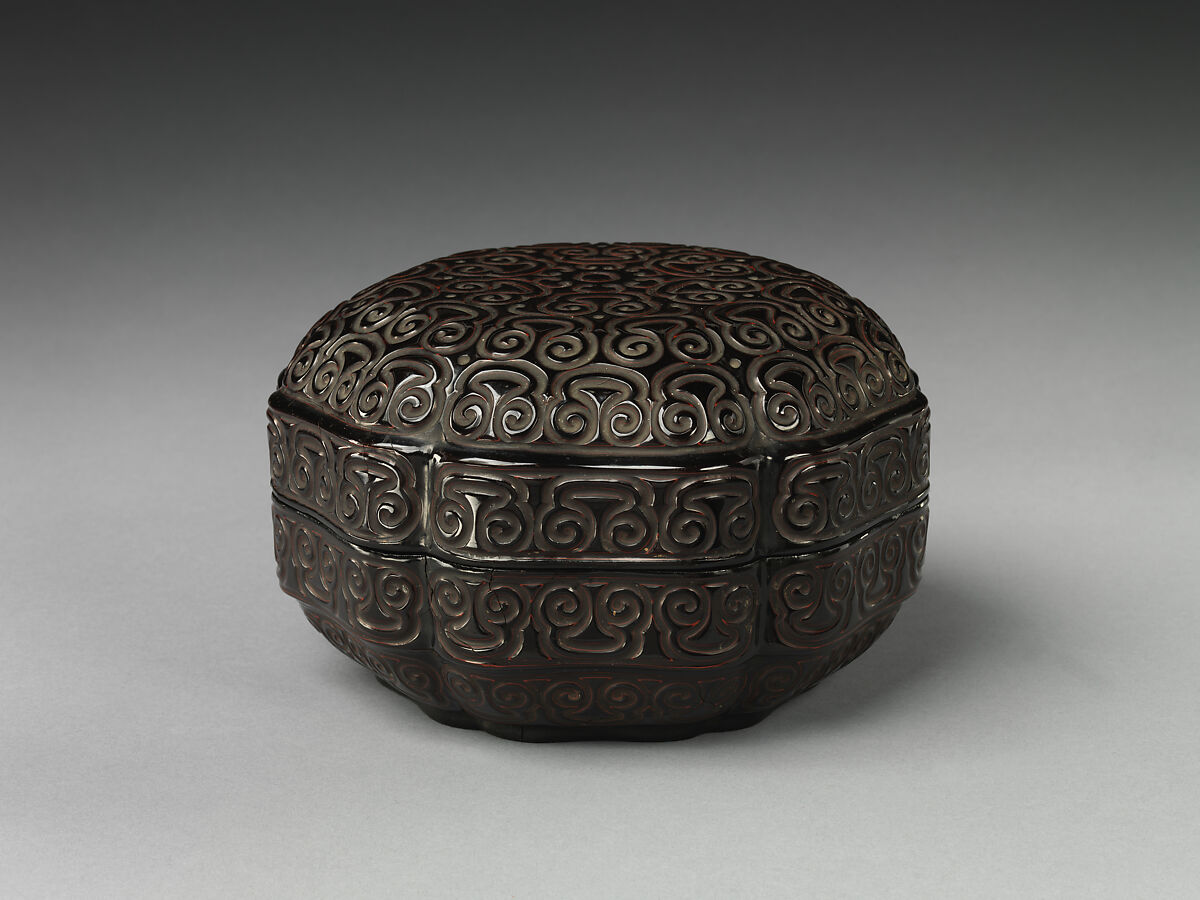 Hexagonal box with inverted corners, Carved black lacquer with red layers, China 