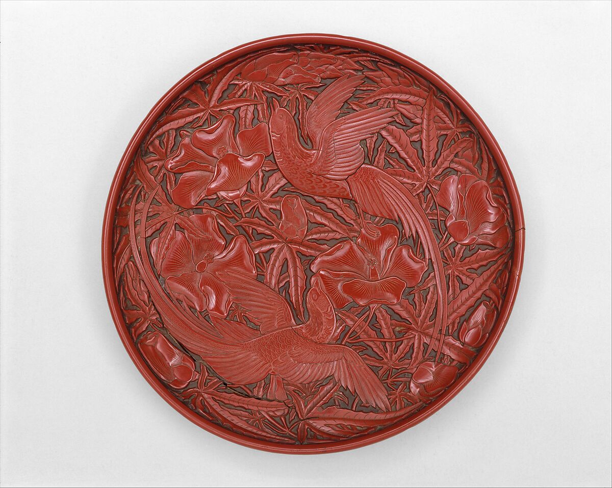 Dish with long-tailed birds and hibiscuses
