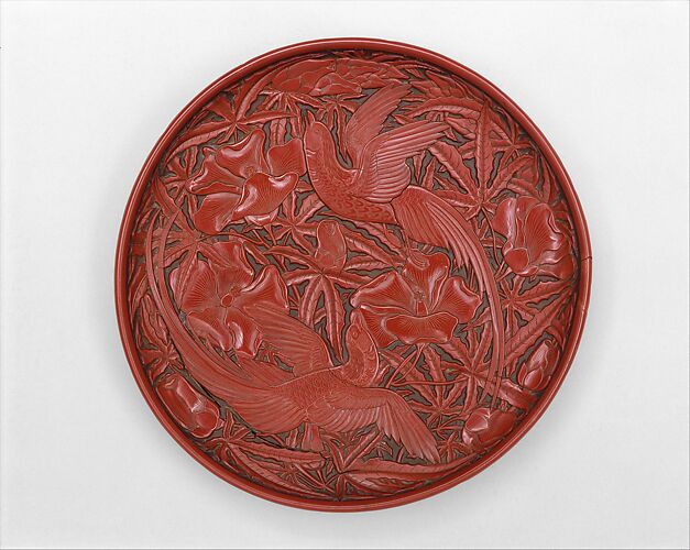 Dish with long-tailed birds and hibiscuses