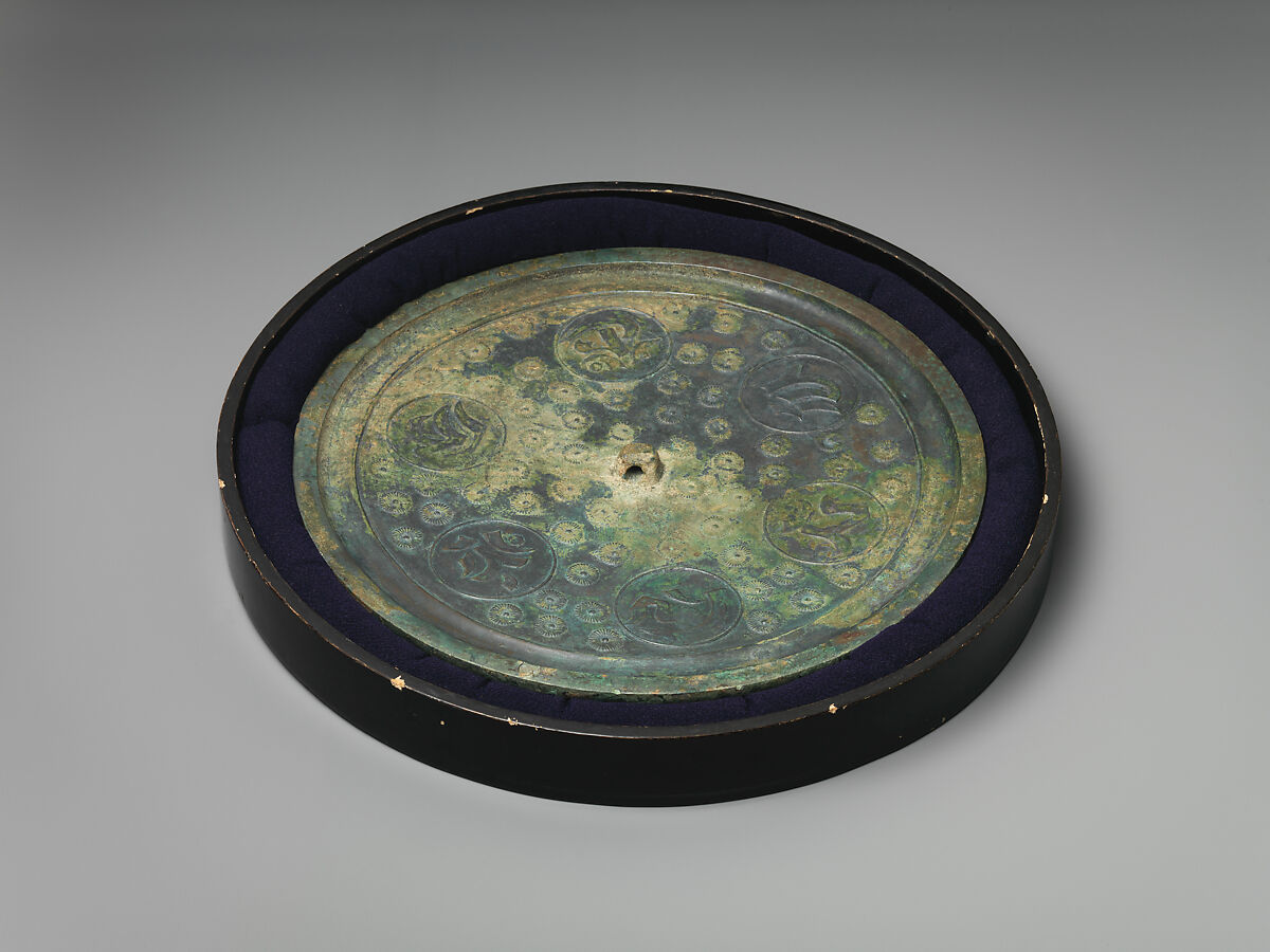 Mirror, and Mirror Box (Kagami-bako) with Feather Crest and Peony Scrolls, Lacquered wood with gold hiramaki-e on black lacquer ground; bronze mirror, Japan