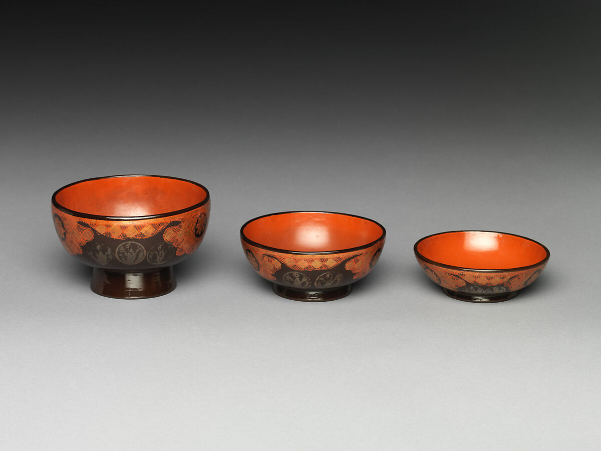 Three Nesting Bowls (Mitsuwan), Red and black lacquer on wood; applied decoration with gold and silver foil, Japan