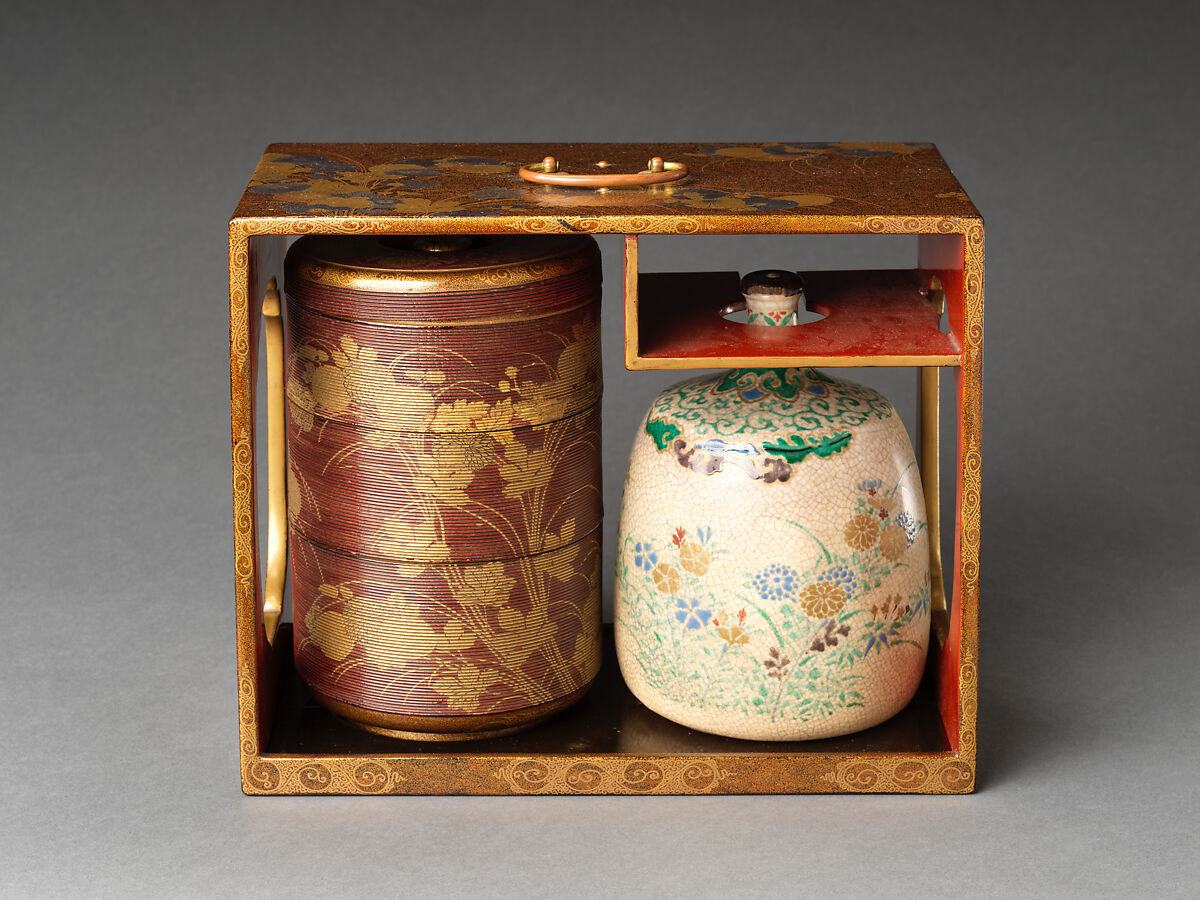 Picnic set with decoration of chrysanthemum and autumn grasses, Sprinkled gold and silver maki-e on red lacquer cabinet; sprinkled gold and black lacquer on red lacquer boxes; Kyoto-ware sake bottle (glazed stoneware with enamels), Japan