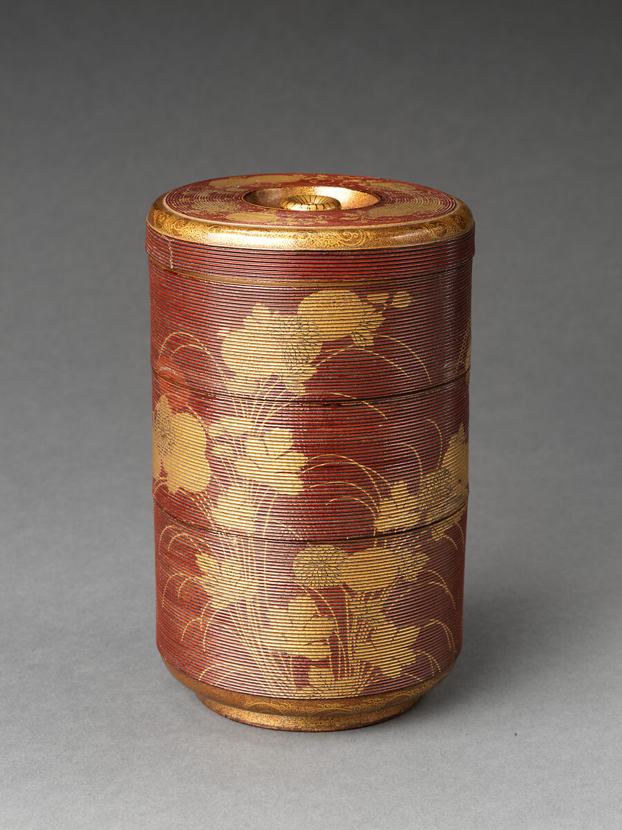 Picnic set with decoration of chrysanthemum and autumn grasses, Sprinkled gold and silver maki-e on red lacquer cabinet; sprinkled gold and black lacquer on red lacquer boxes; Kyoto-ware sake bottle (glazed stoneware with enamels), Japan