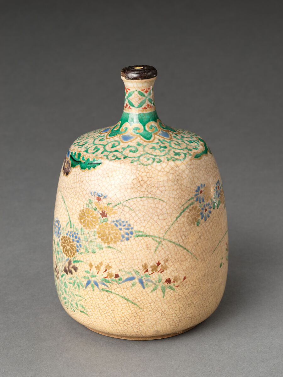 Picnic set with decoration of chrysanthemum and autumn grasses, Sprinkled gold and silver maki-e on red lacquer cabinet; sprinkled gold and black lacquer on red lacquer boxes; Kyoto-ware sake bottle (glazed stoneware with enamels), Japan