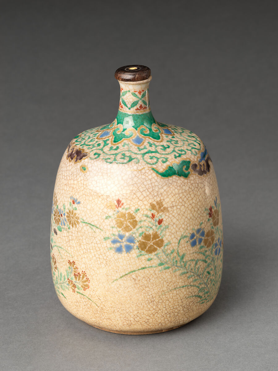 Picnic set with decoration of chrysanthemum and autumn grasses, Sprinkled gold and silver maki-e on red lacquer cabinet; sprinkled gold and black lacquer on red lacquer boxes; Kyoto-ware sake bottle (glazed stoneware with enamels), Japan