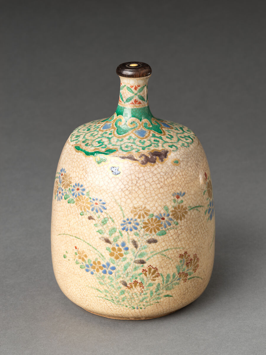Picnic set with decoration of chrysanthemum and autumn grasses, Sprinkled gold and silver maki-e on red lacquer cabinet; sprinkled gold and black lacquer on red lacquer boxes; Kyoto-ware sake bottle (glazed stoneware with enamels), Japan