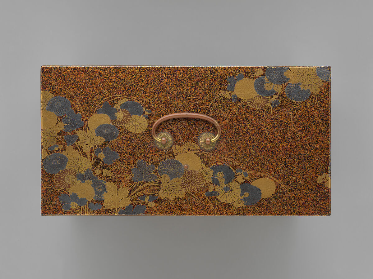 Picnic set with decoration of chrysanthemum and autumn grasses, Sprinkled gold and silver maki-e on red lacquer cabinet; sprinkled gold and black lacquer on red lacquer boxes; Kyoto-ware sake bottle (glazed stoneware with enamels), Japan