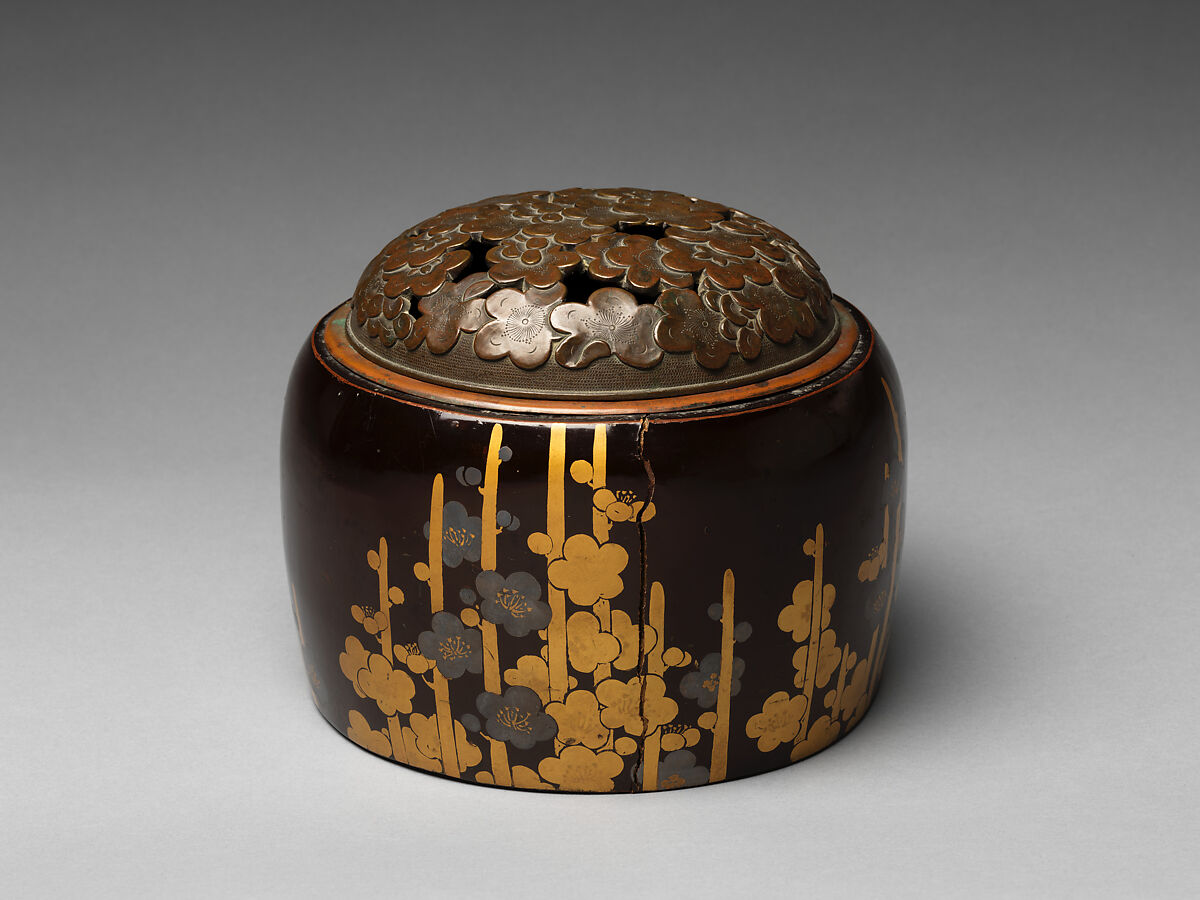 Handwarmer with decoration of plum blossoms, Gold and silver makie on black lacquer, bronze openwork cover, Japan 