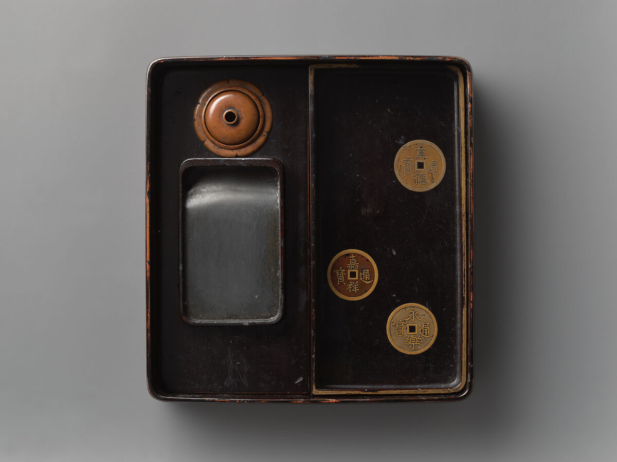 Box for writing implements with design of ancient coins, Gold and mixed metal makie with inlaid mother-of-pearl, on black lacquer, Japan