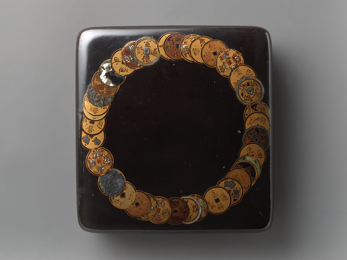 Box for writing implements with design of ancient coins, Gold and mixed metal makie with inlaid mother-of-pearl, on black lacquer, Japan