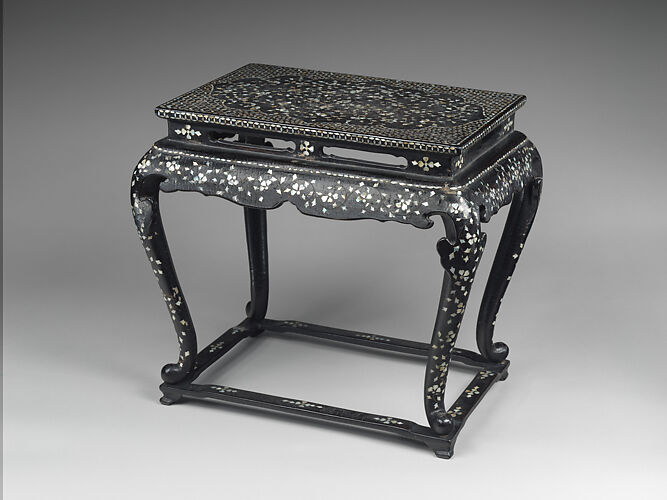 Table decorated with floral scroll