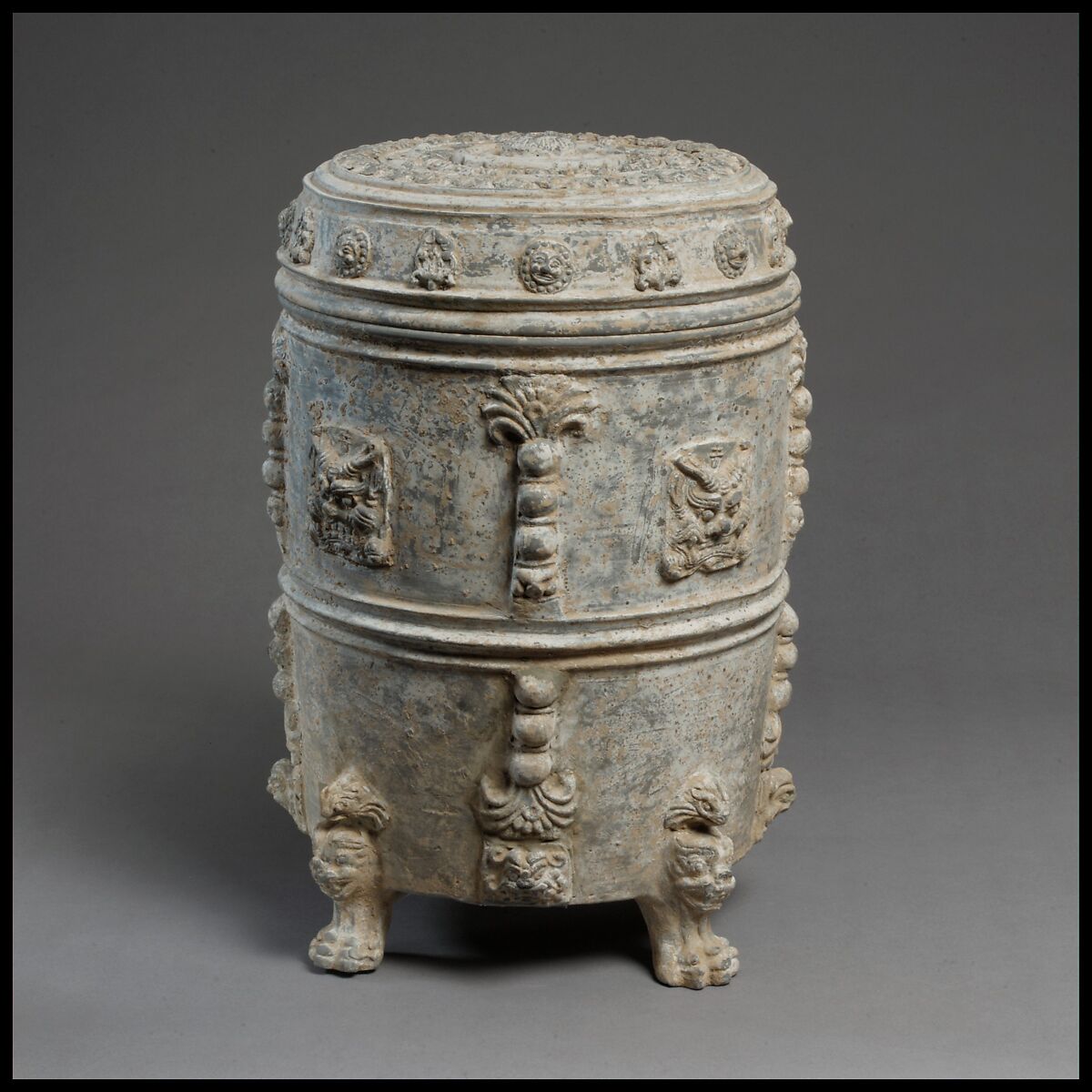 Covered footed vessel
, Earthenware with applied-relief decoration under white slip, China