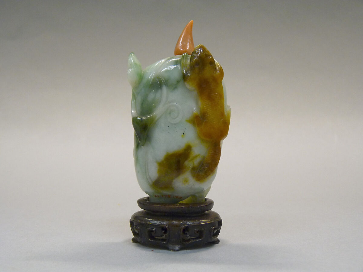 Snuff Bottle, Green and white jadeite with brown spots; coral stopper; wood stand, China 