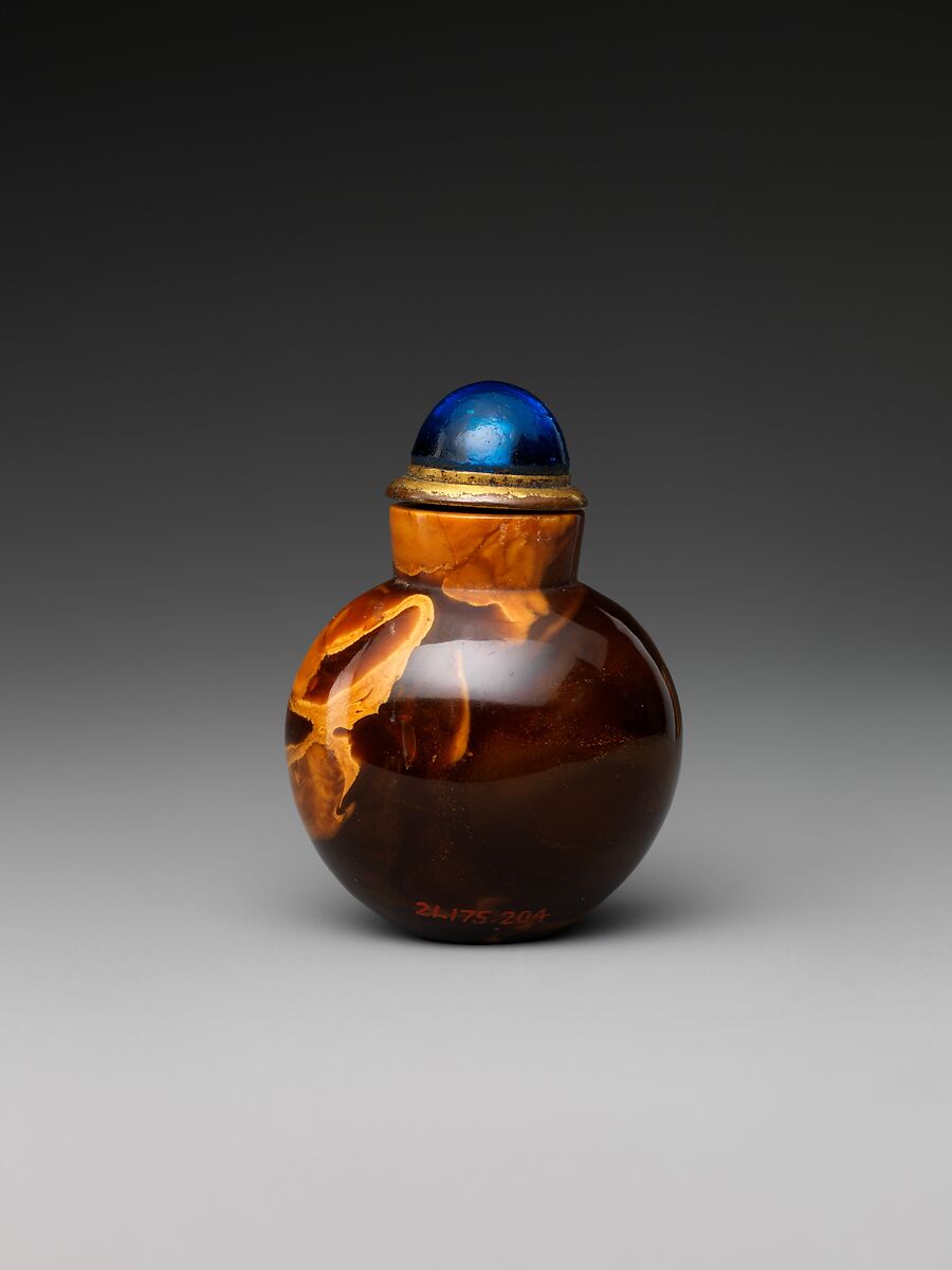 Snuff bottle, Amber with blue glass stopper, China