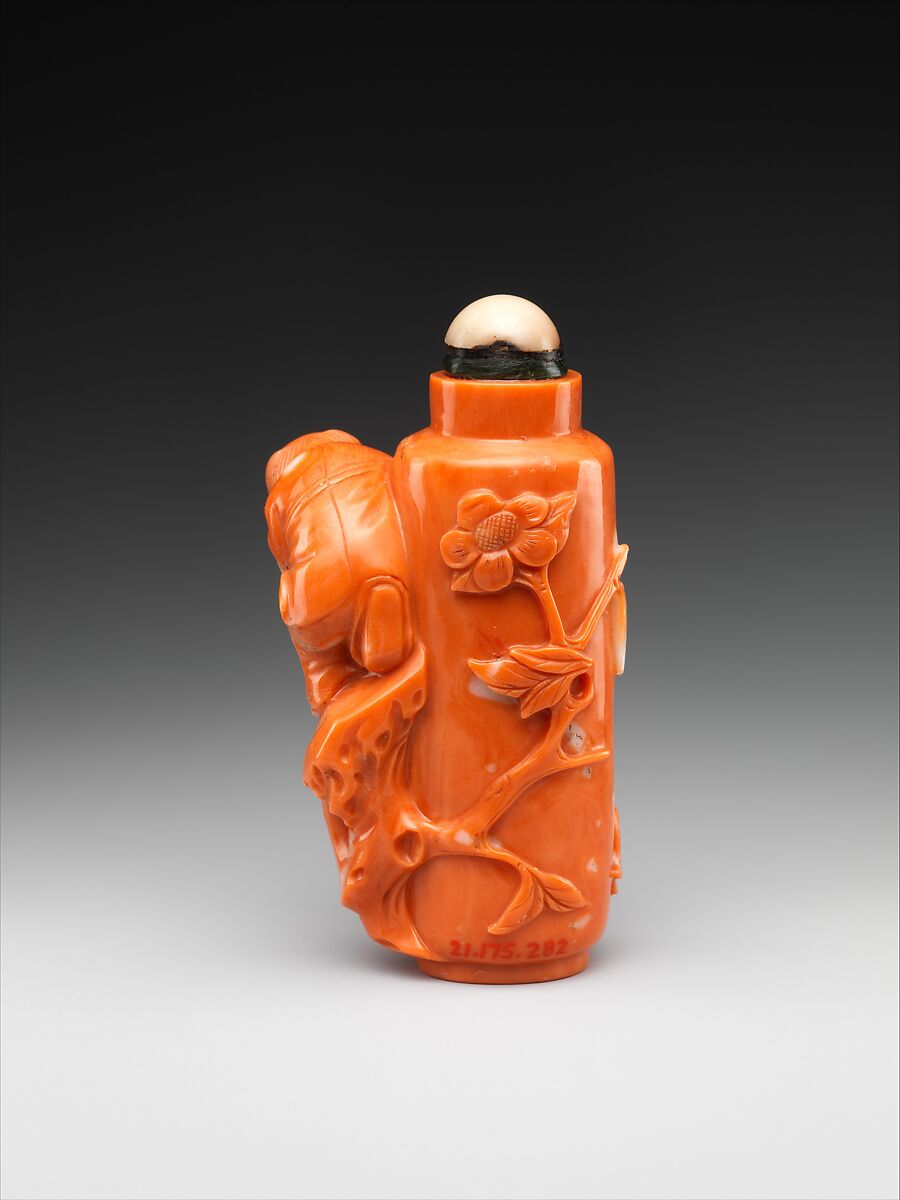 Snuff bottle with boy flying a bird, Coral, China