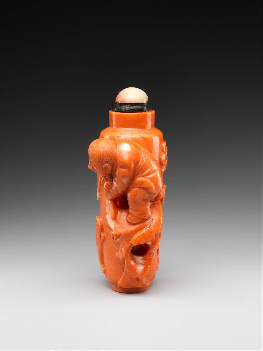 Snuff bottle with boy flying a bird, Coral, China