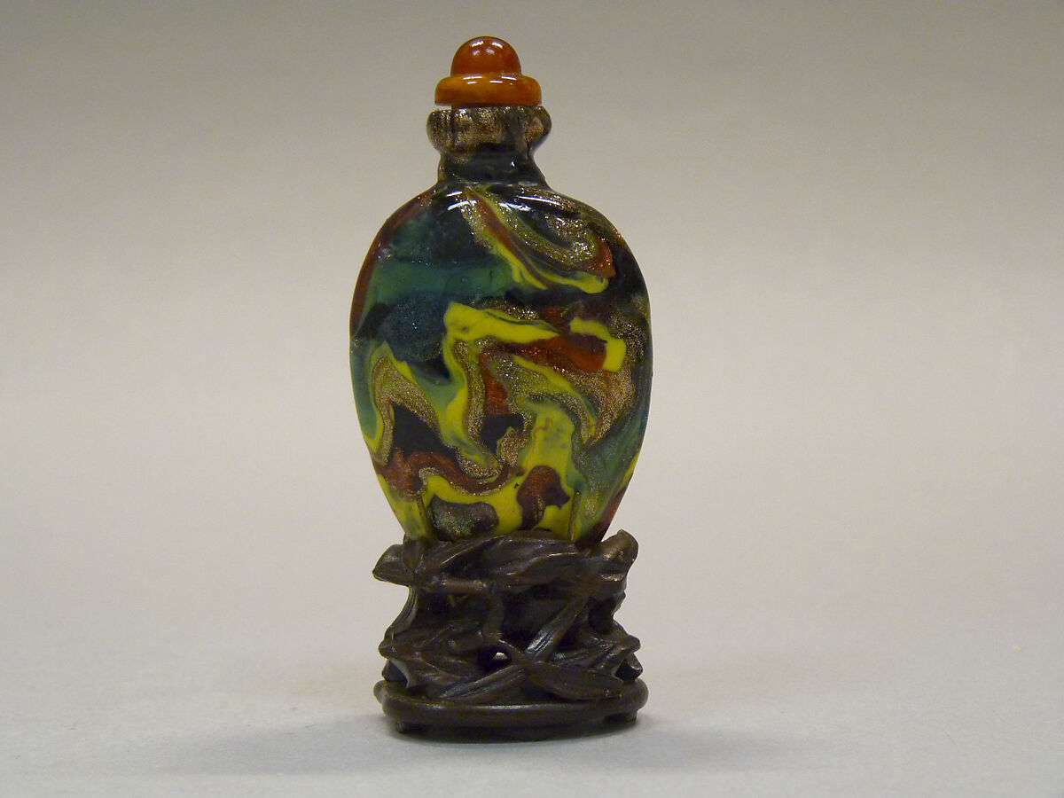 Snuff Bottle, Varicolored glass with yellow and red amber stopper, wood stand, China 