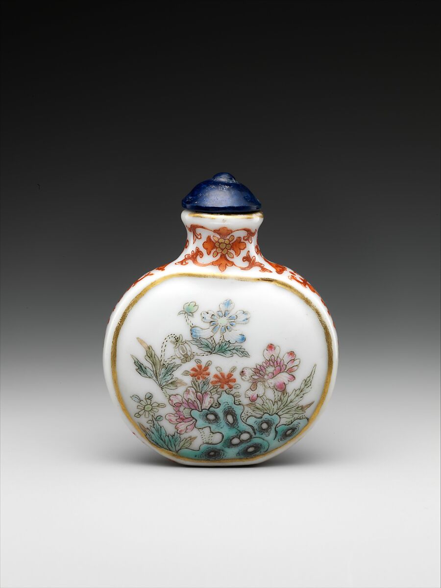 Snuff bottle with flowers and rocks, Porcelain painted with colored enamels over a transparent glaze (Jingdezhen ware) and blue glass stopper, China