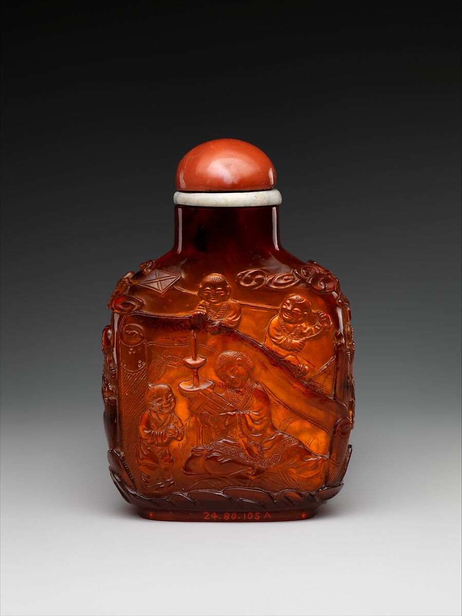 Snuff bottle with women and children in a garden, Amber with coral stopper, China