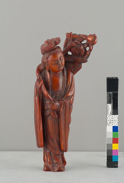 Standing Figure of Daoist Immortal (He Siengu), Amber, China 