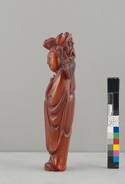 Standing Figure of Daoist Immortal (He Siengu), Amber, China