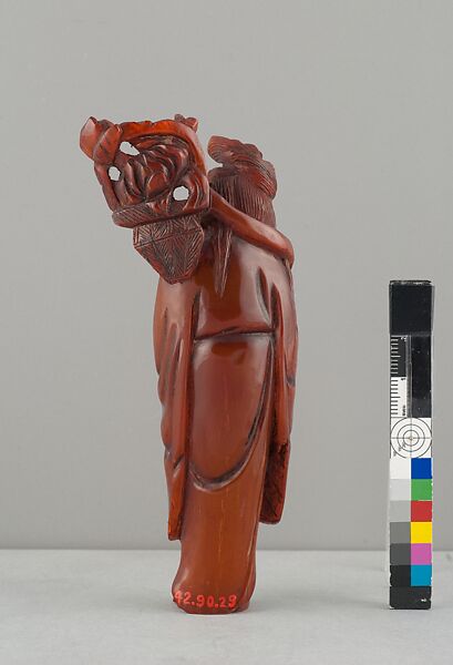 Standing Figure of Daoist Immortal (He Siengu), Amber, China