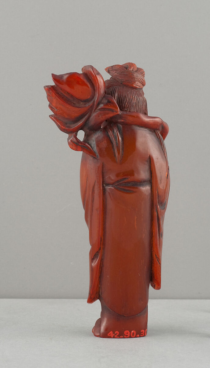 Standing Figure of Daoist Immortal (He Siengu), Amber, China