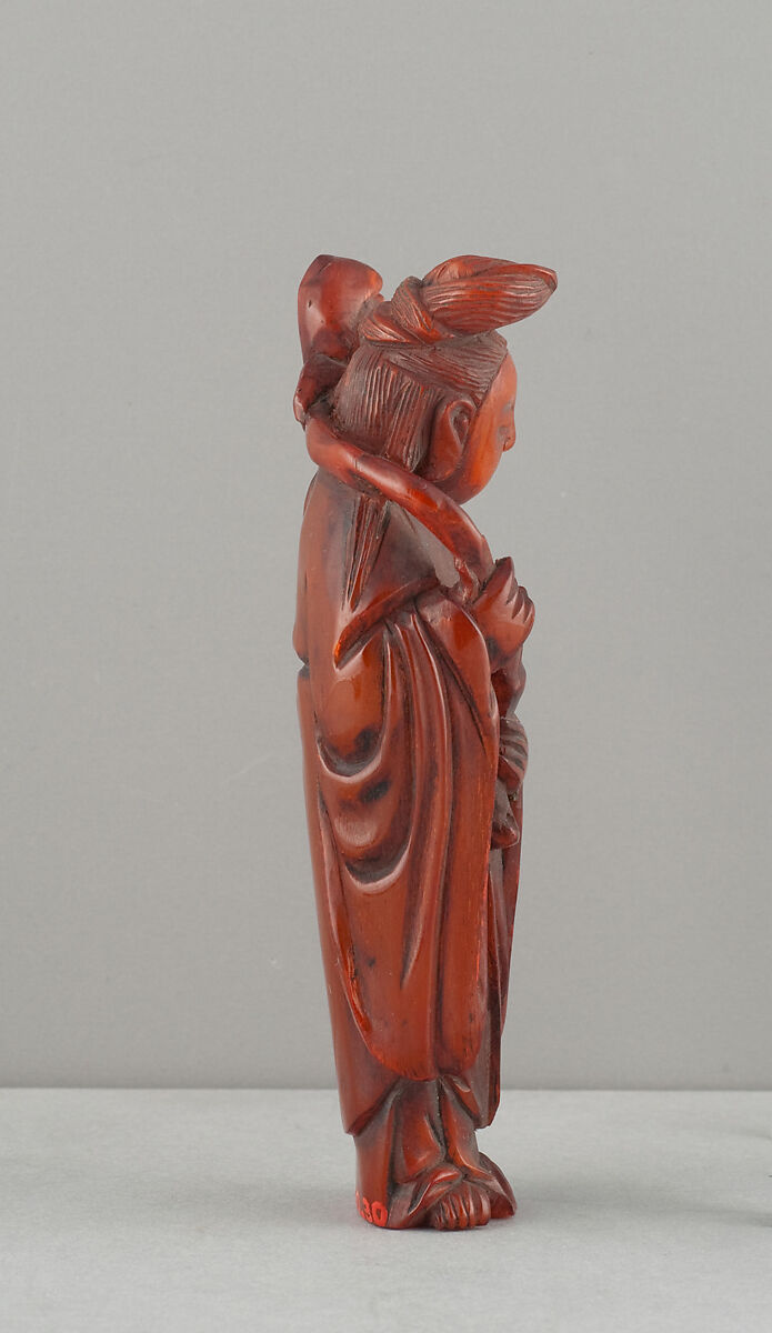 Standing Figure of Daoist Immortal (He Siengu), Amber, China
