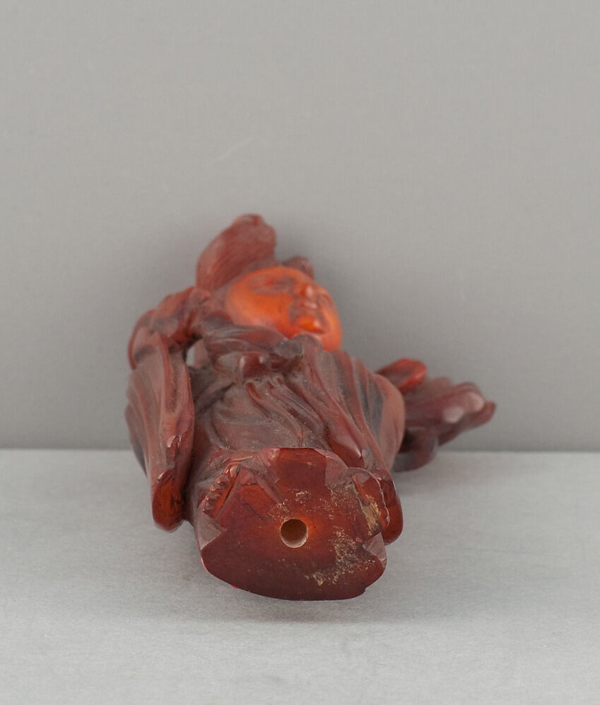 Standing Figure of Daoist Immortal (He Siengu), Amber, China