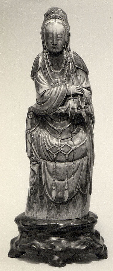 Seated Figure of Guanyin on Rock Base with Carved Armrest, Ivory, wood, China 