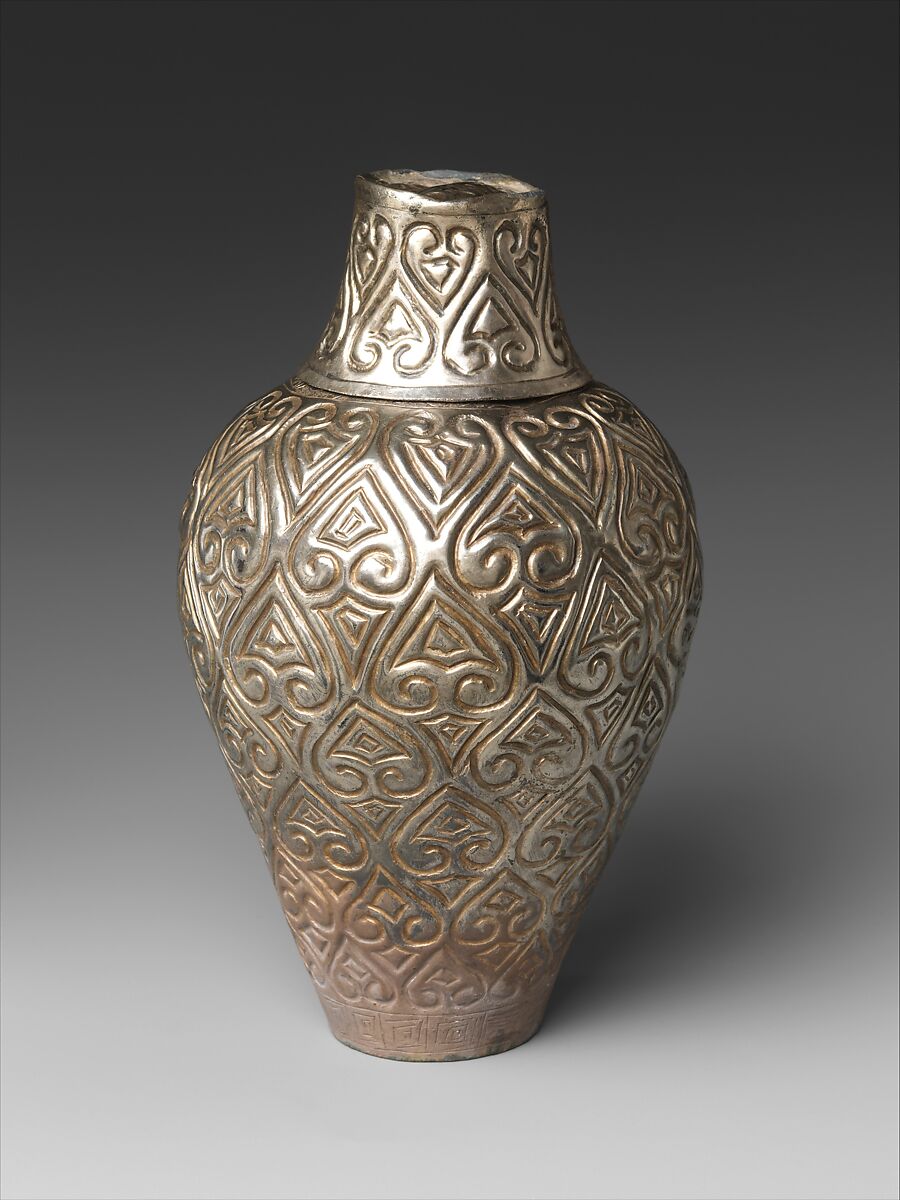 Covered bottle with cloud scrolls, Silver with incised designs, China 